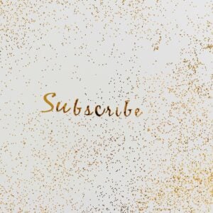 Golden 'Subscribe' text with charming glitter effect on a clean background.